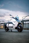 BMW's CE-04 electric scooter on a carpark rooftop at sunset BMW's CE-04 electric scooter on a carpark rooftop at sunset