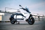 BMW's CE-04 electric scooter on a carpark rooftop at sunset BMW's CE-04 electric scooter on a carpark rooftop at sunset
